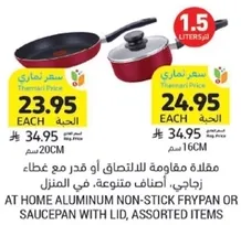 Aluminum non-stick frypan or saucepan with lid, assorted items.