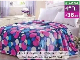 Double blanket with colorful polka dots design.