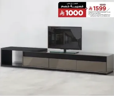 Modern TV stand with storage drawers and a sleek design.
