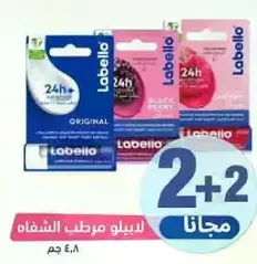 Labello lip balm, 24h+ moisture, original, black cherry, and raspberry flavors.