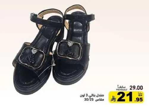 Stylish black sandals with a decorative buckle.