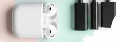 Wireless earbuds with charging case and additional adapters.